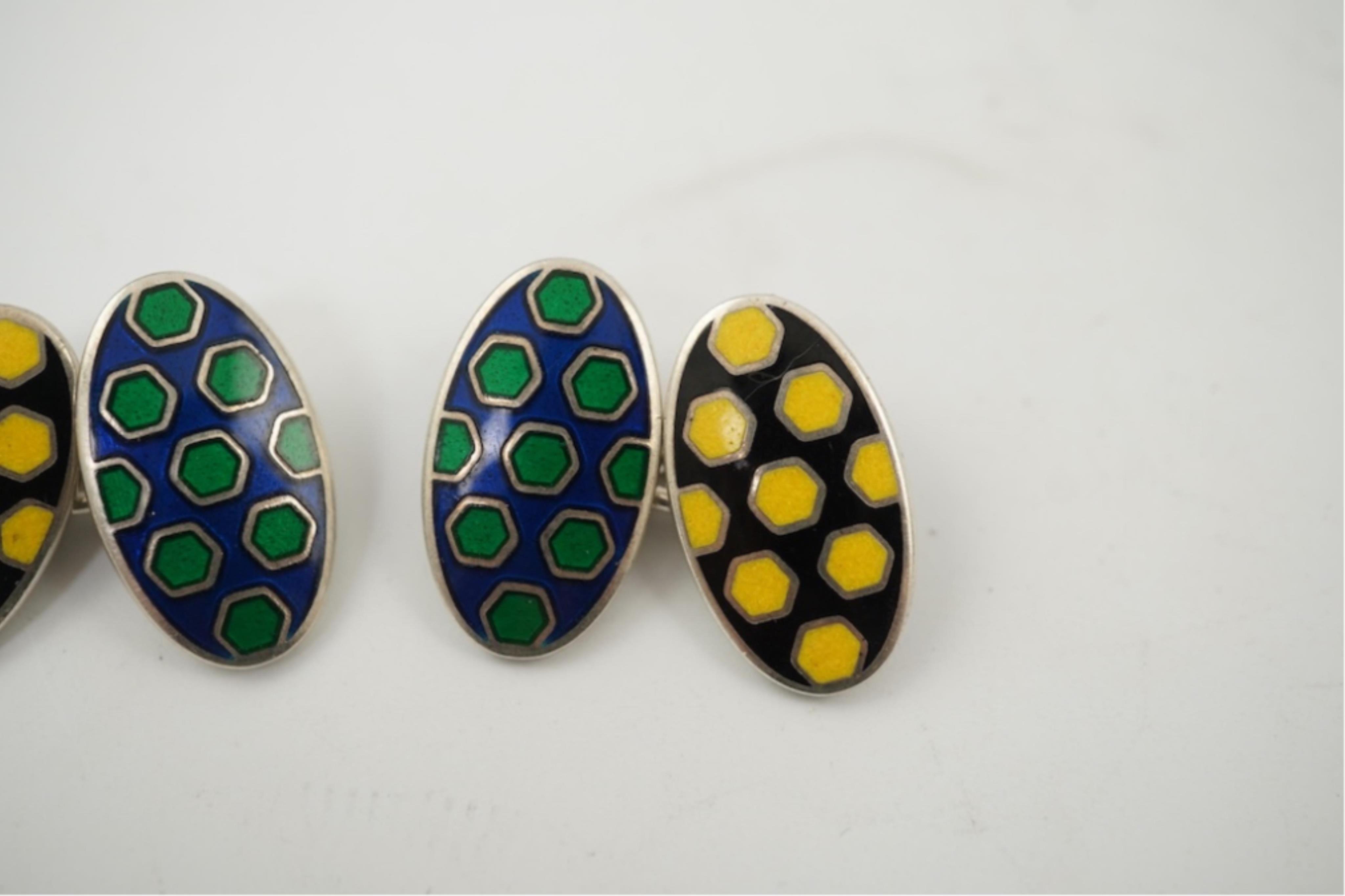 A modern pair of silver and polychrome enamel set oval cufflinks, 18mm.